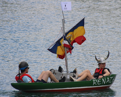 Team boat flying the flags